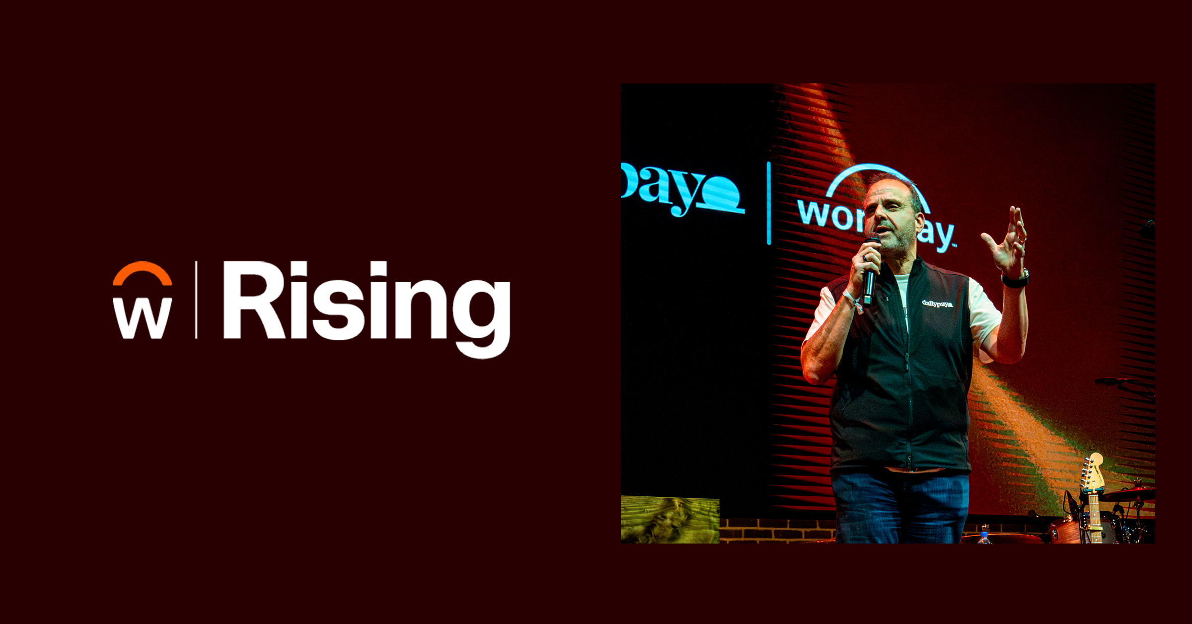A man speaks on stage with a microphone in front of a screen displaying the Workday logo; text on the left reads “w Rising.”.